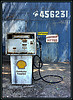 gas pump - Photo is of an old rusty gas pump with a Shell Gas logo on the front if it.