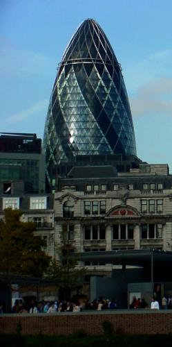 the Gherkin - London England -  A peck of pickle trivia:  * Height - 180 m (600ft) * In spite of its round and curved appearance, the tower is composed of 745 flat glass panels. The only curved panel being the cap on the very tip top of the tower. * The building incorporates both passive (convection) cooling and heating, and utilizes the natural light to reduce the cost of illuminating workspaces during the day. * The fortieth floor is occupied by a panoramic bar in the dome with 360° views. * The gherkin can be seen from 30km (20mi) away in Windsor.  I have an extensive travel history. My journeys have taken me to over 40 wonderful countries. I do have some tales to tell and do so at a couple different places on the web. You can find more travel tales and information on my blog - ¿Where the Heck are You? - at this link:  http://wheretheheckareyou.blogspot.com