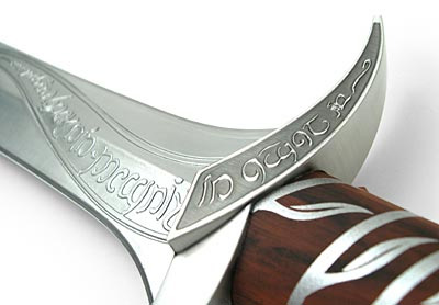 Sting - The above is the hilt of the Sword given to Frodo by his uncle Bilbo Baggins named Sting. The above is actually made by a company, and it glows too, in presence of Orcs.. lol Kidding.. It can run on two batteries and it has four different kinds of sounds and can be made to glow. Costs $99.. Looks real and has the inscription from the original Sting on it in elvish which in English means' Sting is my name, I'm the Spider's bane'