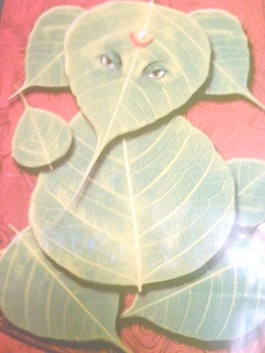 Lord Vinayaka - This photo is of the Hindu God Lord Vinayaka. The form of the God was obtained by skillfully arranging seven leaves of a banyan tree. It is customary for people to view Lord Vinayaka in different funny forms.The head of the deity is that of an elephant. All new works, by Hindus are, started by invoking a prayer on, also known as, Lord Vigneswara.