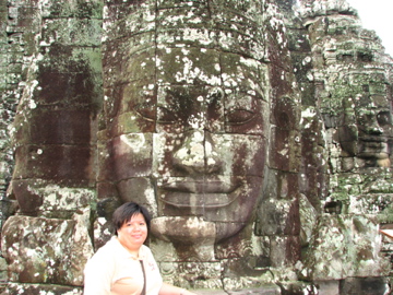 Bayon Temple - Me with one of the heads in Bayon Temple