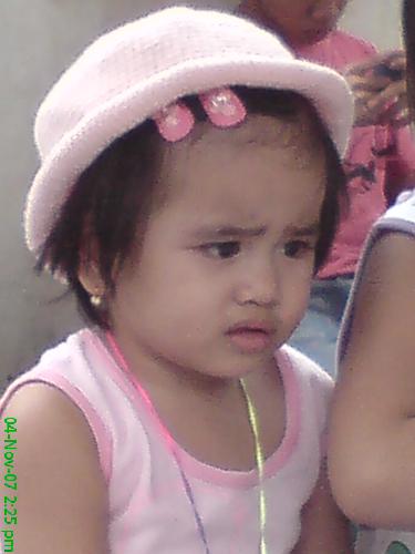 My litle neice watching a DVD movie - I was so amused to see my little niece watching intently a DVD movie as if she really understood the movie having her forehead wrinkle up like thingking. Isnt she cute?