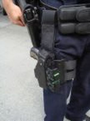 Police Tazers - A picture of a policeman with a tazer gun strapped to his leg.