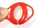 Condom wins the prize for design, yes (Design Inda - Picture of a condom designed to look pretty, red with handles