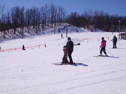 ski trip - my daughter skiing with her grandparents