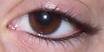 eyeliner - eye lined with black eyeliner