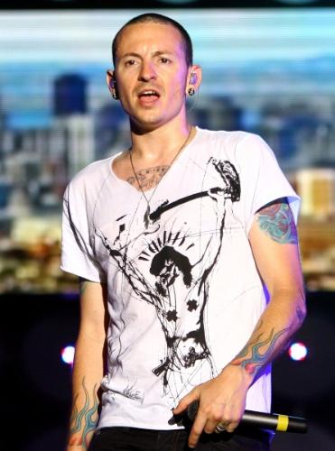 chester bennington -  Chester Charles Bennington (born March 20, 1976)[1] is an American musician. He is currently Linkin Park's lead vocalist and frontman. Biography  [edit] Early years  Bennington was born in Phoenix, Arizona.[1] He took interest in music at a young age, citing Depeche Mode and Stone Temple Pilots as early inspirations.[1] Bennington's parents separated in the late 1980s, while he was still a child.[1] He was sexually abused during his youth, and later struggled with cocaine and methamphetamine addictions.[1] Bennington eventually overcame his drug addiction, and would go on to denounce drug use in future interviews.[2] He worked at a Burger King restaurant before starting his career as a professional musician.[1]  [edit] Professional music career  Before joining Linkin Park, Bennington was a vocalist in Grey Daze, a now-defunct grunge band from Phoenix, Arizona.[3] He left Grey Daze in 1998, but struggled to find another band to play in.[3] After nearly quitting his musical career altogether, Jeff Blue, then the vice president of A&R at Zomba Music in Los Angeles, offered Bennington an audition with the future members of Linkin Park.[3] Bennington quit his day job, and took his family to California, where he had a successful audition with Linkin Park, who were then called 'Hybrid Theory.'[3] Bennington and Mike Shinoda, the band’s other vocalist, made significant progress together, but failed to find a record deal.[3] After facing numerous rejections, Jeff Blue, now a vice president of A&R at Warner Bros., intervened again to help the band sign with Warner Bros. Records.[3]  Despite having prodigious success in the early 2000s, Bennington has had medical issues outside of the limelight. He suffered a severe bite from a recluse spider while touring with the OzzFest in 2001, which caused his arm to swell.[4] Bennington was plagued with poor health during the making of Meteora, and struggled to attend some of the album’s record sessions.[5] He fell ill during the summer of 2003, and eventually underwent surgery.[6] Bennington sustained a wrist injury in October 2007 while attempting to jump off a platform during a show in Melbourne, Australia. Despite the injury, he continued to perform, and went to the emergency room after the show.[7]  [edit] Personal life  Bennington married his first wife, Samantha, on October 31, 1996.[8] They had one child, named Draven Sebastian, who was born on April 19, 2002.[8] Bennington’s relationship with Samantha declined during his years with Linkin Park, leading to their divorce in 2005.[9] After divorcing his first wife, Bennington married Talinda Bentley, a former Playboy model, [8] with whom he has since had a child, Tyler Lee. [8] He and his family live in a 6,000-square-foot house in Newport Beach Orange County when he is not on tour.[10] Bennington made a cameo in the film Crank.[11] He is also an avid tattoo enthusiast.[10] In addition to sporting many tattoos and piercings all over his body, he has done work with Club Tattoo, a tattoo parlor in Tempe, Arizona. The parlor has received recognition from many magazines such as College Affair and Skateboard Mag, while also spawning an art show in New York City.[12][13]