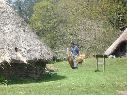 Michelham Priory - Iron Age Centre - Some Iron Age workshops built on the other side of the moat at Michelham Priory. All built from tree branches, and thatched, the buildings give an authentic, Iron Age feel to the area. Note the guy carrying batches of straw. :)