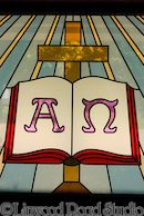 stained glass window - alpha and omega and cross