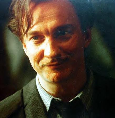 Remus Lupin - This is a picture of Remus Lupin from the movie Harry Potter. The actor who portrays Remus Lupin is David Thewlis. We first meet the character Remus Lupin in Harry Potter and the Prison of Azkaban.