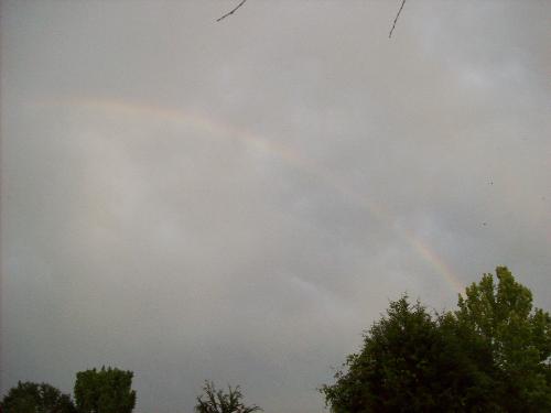 A rainbow in the storm clouds - This is a snap I made of a rainbow among the storm clouds