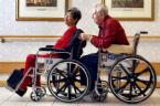 old people - two old people on their wheelchairs