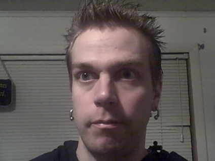 spikey hair and thick earrings - this photo is from 4/8/08.i was sporting spikey hair to go with the punk rocker with earrings look.when i dont feel like earrings i wear my hair flat down.