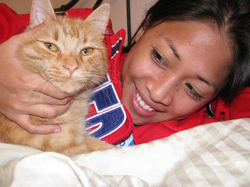 MarfZie - This pic was taken because our dearly kitty named Slicky loves to stick and lay down beside me, and my fiance decided to take a shot and here it is!