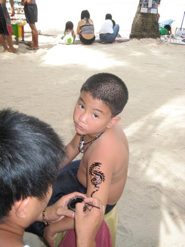 Christian Getting His 1st Henna Tattoo  - Because of his obsession with wrestling superstar Batista, Christian, my seven-year old son persuaded us to get his first henna tattoo same place as Batista&#039;s. 