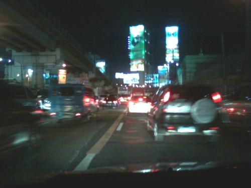 Traffic in the city - This was taken using my trusty LG mobile phone, so the resolution isn't that great. Whenever I'm stuck in traffic, I tend to get bored listening to the radio and thinking of ways to solve the traffic problem in Manila. So, a lot of times, I just snap up a few pictures of the traffic jam. I don't know why I do it but it's an entertaining way to pass time.