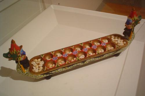 Congklak, a traditional games from Indonesia. The  - Congklak, a traditional games from Indonesia. The board made by wood.