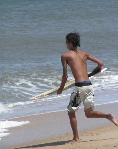 Running for the Wave - I caught this picture of a young boy trying to catch a small wave to surf. I was surprised that he actually managed to stay up on several puny waves. Taken at St. Augustine Beach, FL.