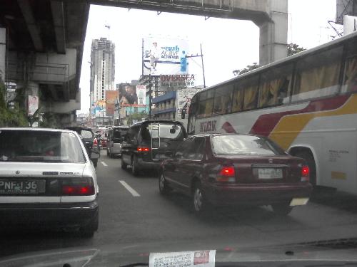 Traffic in the city 2 - This one is a day version. As you can see, it's traffic anytime of the day in Manila. The main cause being slow moving trucks as well as humongous buses blocking the road.