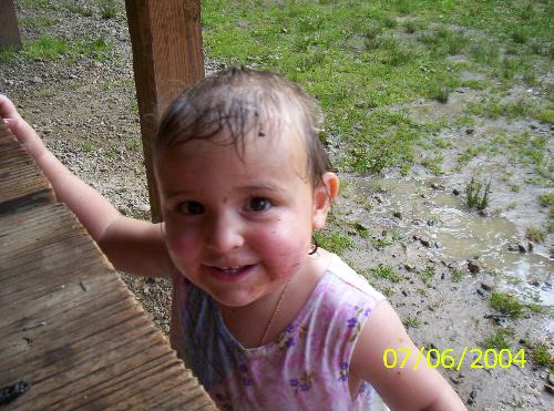 Gabby -  This is Gabby when she was 2 1/2 years old. She was playing in her first mud puddle adn in the rain.