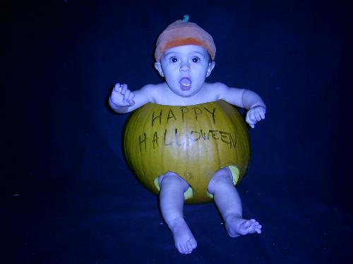 My granddaughter, the pumpkin - This was my granddaughter, 4 months old, at Halloween of 07