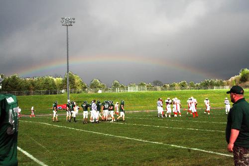 Rainbow during a football game - This photo was taken with my Canon Digital Rebel using the P mode with the ISO at 800. I was using a Tamron f3.5-5.6 28-200mm zoom lens. I then did some enhancement using Photoshop Elements v 3.0