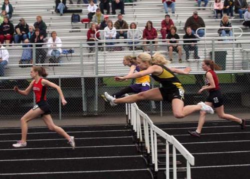 Hurdlers at Track Meet - This was taken with a Canon Digital Rebel in the P mode with an ISO of 1600. I was using a Tamorn 28-200 f3.5 - 5.6 lens. The only editing done was cropping and resizing the photo for mylot. Hurdlers at Track Meet - This was taken with a Canon Digital Rebel in the P mode with an ISO of 1600. I was using a Tamorn 28-200 f3.5 - 5.6 lens. The only editing done was cropping and resizing the photo for mylot.