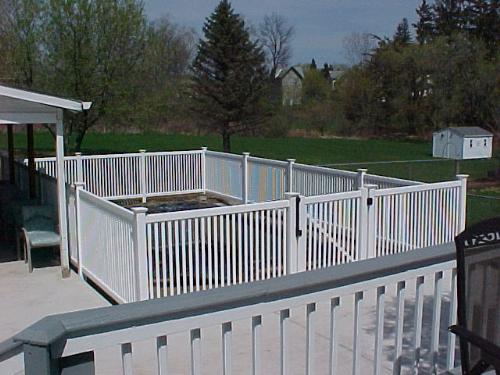 vinyl pool fence - This is a lifetime warrantied, vinyl fence. It meets all federal regulations for pool safety. Notice the safety latch and self closing hinges. I really enjoy installing these.
