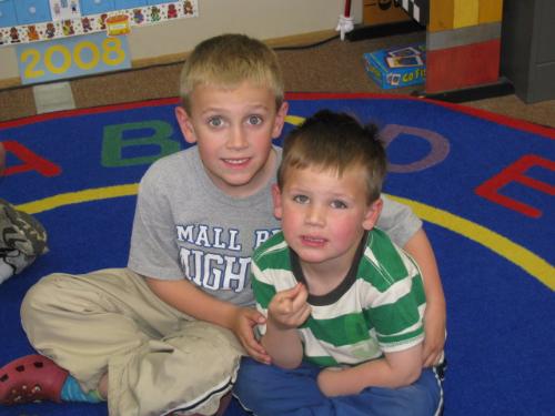 Boys at school - My oldest son was celebrating his birthday at school so my youngest son and I went to celebrate too. This is a picture of them sitting on the carpet during story time. One of the few pictures where they actually look like they get along.