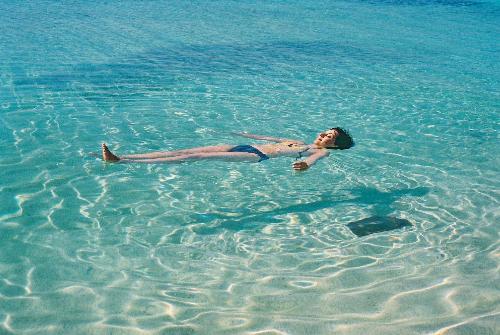 woman floating on clear water - that image is how i view myself doing right now. WISHFUL THINKING!!