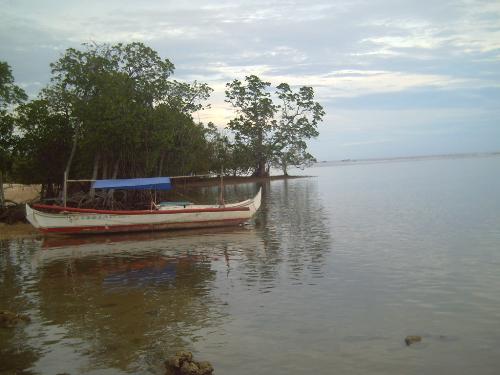 laiya batangas - the other side of the beach with a fisherman's boat