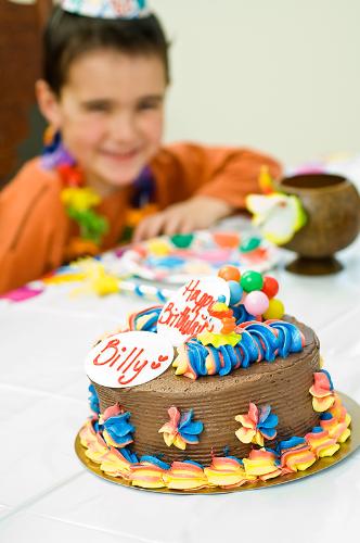 Bithday Cake - Great photo of a child with a birthday cake. You'd get hungry just looking at it! Looks like Devils Food Cake to me.