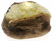 Baked Potato - A potato that is cooked in the form of baking either in an oven or on a grill.