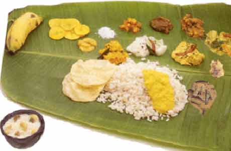 kerala sadya - This is the famous kerela food. This is the famous sadya in kerala. rice is served on a banana leaf. and there are a lot of curry around in various colours. It is also accompanied by a payasam after the food. A pappadam is also served. ( sorry for bad english used)