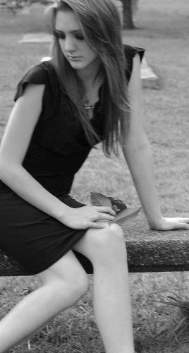 Waiting... - Black and white of girl in cemetary. By Stephanie Partridge 2008.