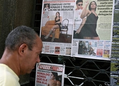 Ronaldo 'ashamed' over transvestite tryst - A man has a look at some Brazilian newspapers frontpages reporting the alleged affair between Brazilian soccer star Ronaldo and local transvestites.Ronaldo revealed Monday that he was 'incredibly ashamed' over last weeks' encounter with a trio of transvestites which he believes will mark him for life.