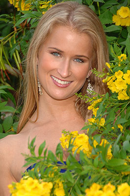 a photo of a beautiful lady - beautiful lady taken with her beautiful flowers.