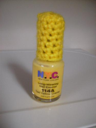 Crocheted Nail Polish Lid Cover - This is a crocheted nail polish lid cover. The pattern is available for free on Squidoo.