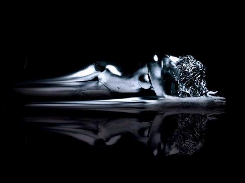 Beautiful Lady In Distress - Silver Woman with sexy look, lays before herself to think.