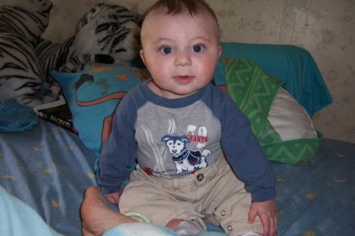 Sitting Pretty - My son sitting up all by himself, he's still not developed in back muscles so he tends to fall down but he's working hard at it!!