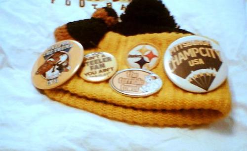 My Dad's Steeler's Cap - My Dad's Steelers Cap. He wore this every time he watched a game on tv, usually wearing a Steelers shirt. Or as he aged, covered in a Steelers blanket to keep warm. The cap has lots of doo-dads on it, like one of the ticket stubs from when he went to the Super Bowl. (He went twice and I don't know where the other ticket stub went.) And a mini-Terrible Towel. And a Steelers pin. When he passed away, I got to have his treasured cap.