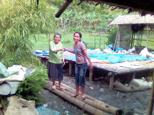 helping hands with a beautiful smile - my cousin helping my mother to pass over the muddy walkway.