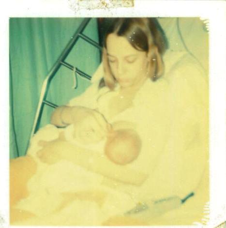 Me and my first born - Gosh, I look like a baby myself.