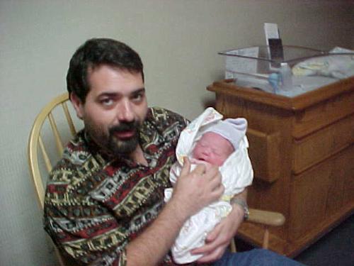 Wade and new son. - My husband and our new born son.