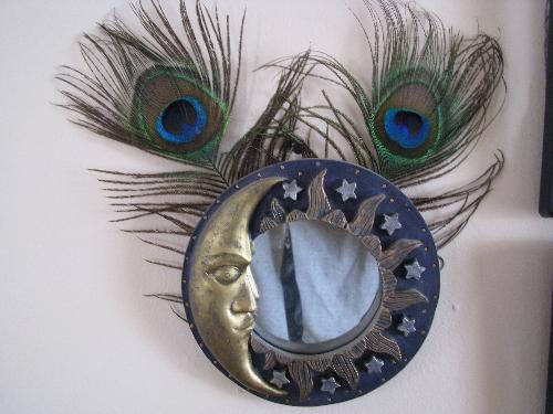 Crescent Moon and Peacock Feathers - Photo from one of many sun/moon symbols that have symbolic significance in the teaching of Wicca