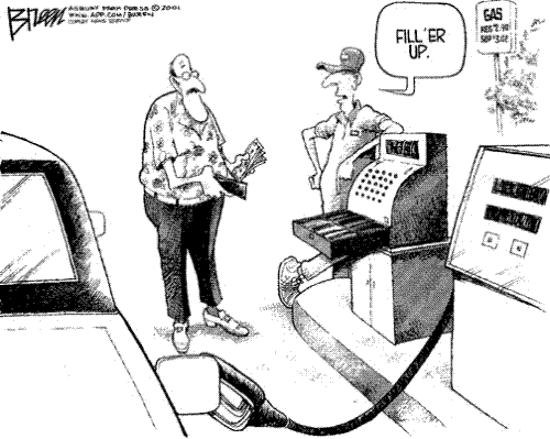 Gas Tank - A man paying to have his gas tank filled.