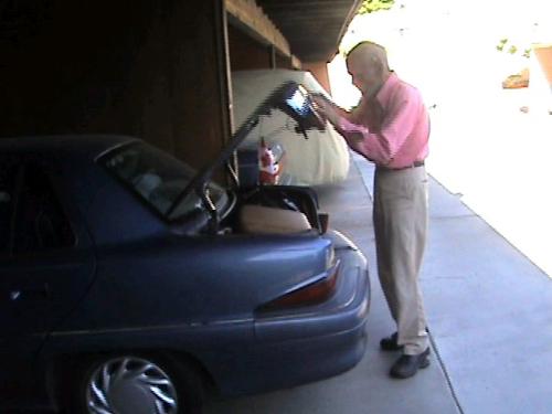 Let's Try This Again. - After his first attempt, he thought that if he slammed the trunk a few more times, the stuff would mysteriously shrink down to size. LOL