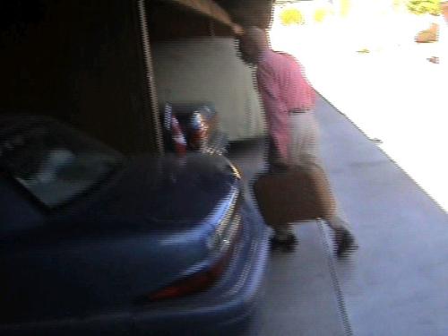 OK This Time It's Going To Fit!! - He checked the other side of the car, and found some room for my suitcase. He put it in there, and we hit the road.