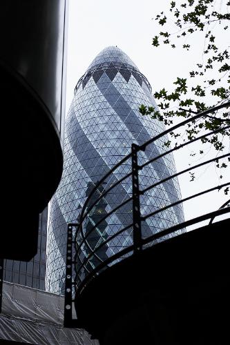The Gherkin - 30 St Mary Axe is a building in London s main financial district, the City of London. It is widely known by the nickname 'The Gherkin', and occassionally as a variant on The Swiss Re Tower, after its previous owner and principal occupier. It is 180 metres (591 ft) tall, making it the second-tallest building in the City of London, after Tower 42, and the sixth-tallest in London as a whole. The building's name is its address - St Mary Ace being the street it is on. The building was designed by Pritzker Prize-winner Lord Norman Foster and ex-partner Ken Shuttleworth and Arup engineers, and was constucted by Skanska of Sweden between 2001 and 2004.