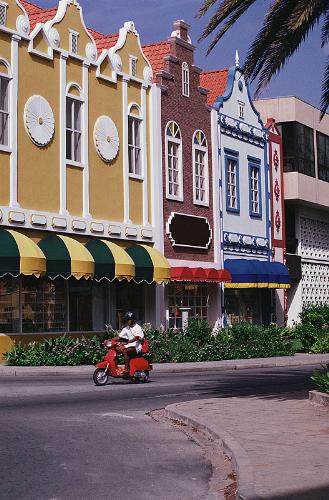 Aruba - Aruba is a 33-kilometer long island of the Lesser Antilles in the souther Caribbean Sea, 27 km noth of the Paraguana Peninsula, Falcon State, Venezuela. A country within the Kingdom of the Netherlands, Aruba has no administrative subdivisions. Unlike much of the Caribbean region, Aruba has a dry climate and an arid, cactus-strewn landscape. this climate has helped tourism as bisitors to the island can reliably expect warm sunny weather. It has a land area of 193 sq km andlies outside the hurricane belt.